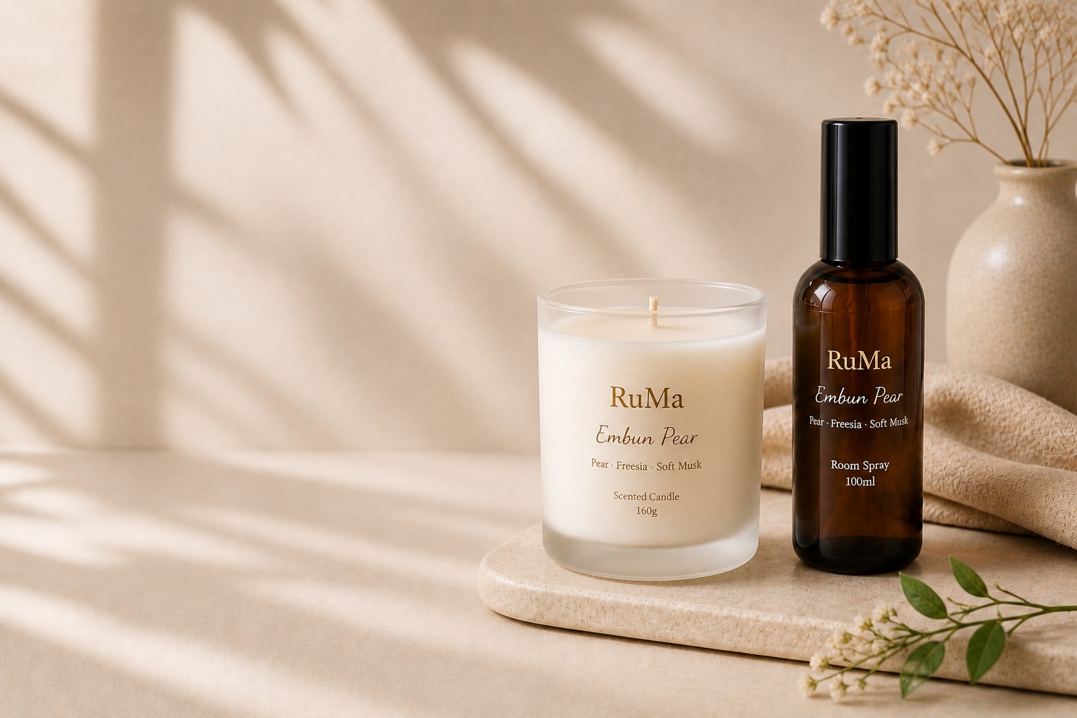 RuMa candle and embossed box on soft linen